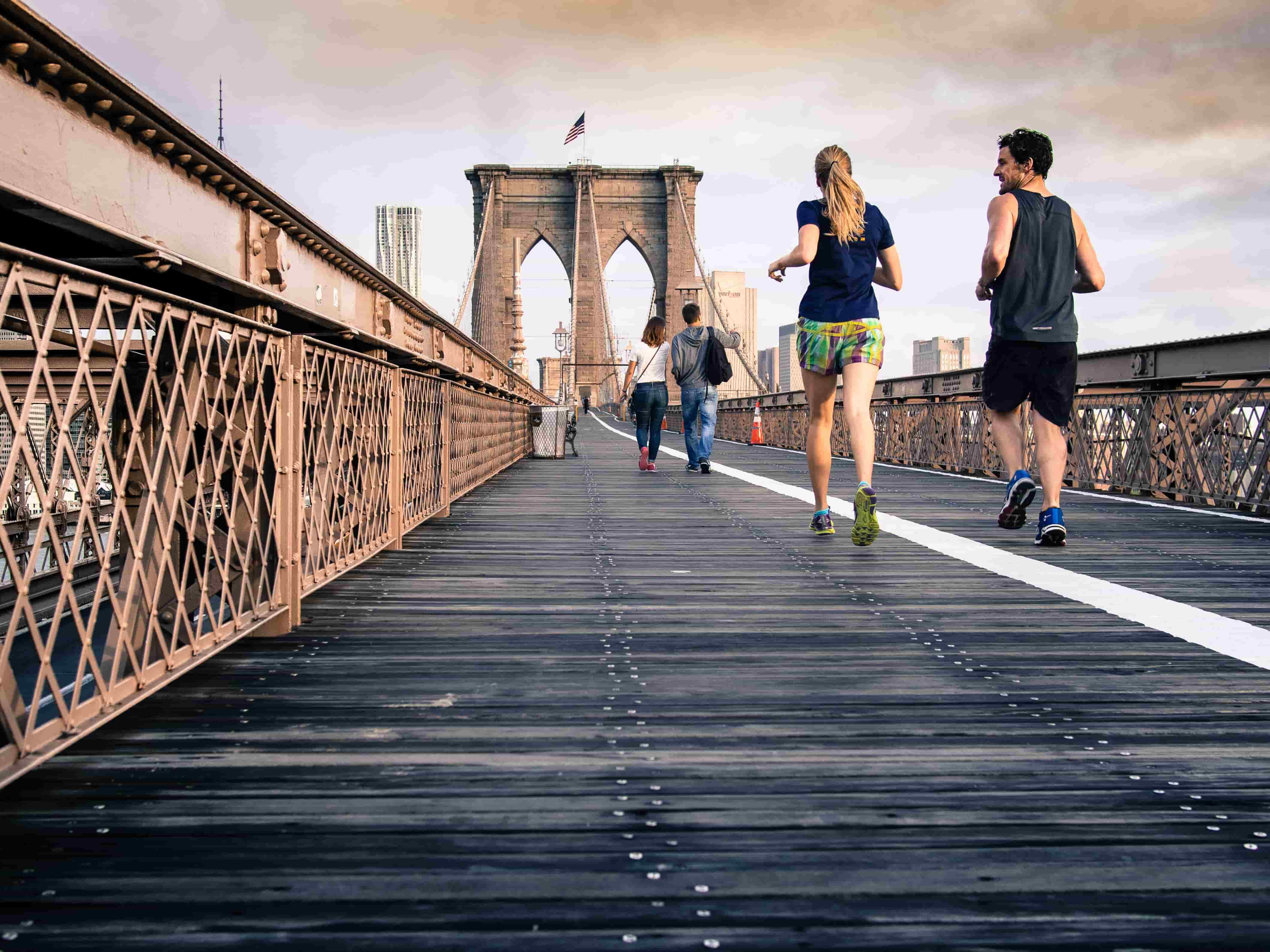 runners on a bridge